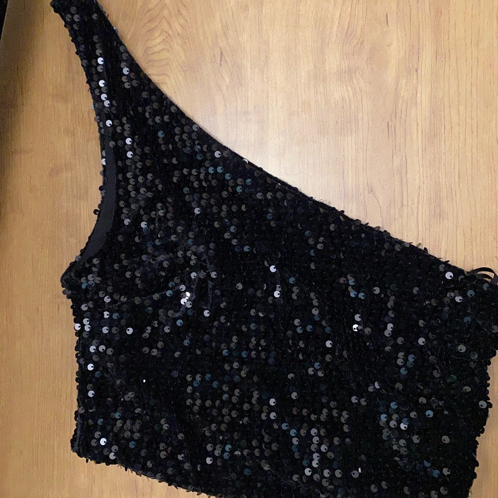 Black sequin one shoulder top.